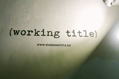 Working title's banner on the wall.