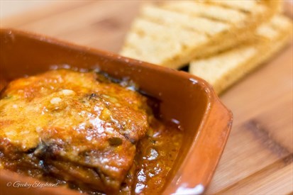 Baked eggplants & tomato sauce served with focaccia bread